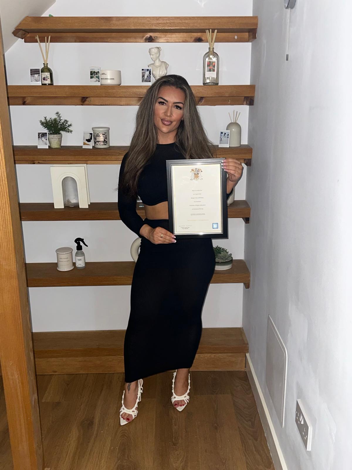 Megan Johnstone holding her Policing degree certificate